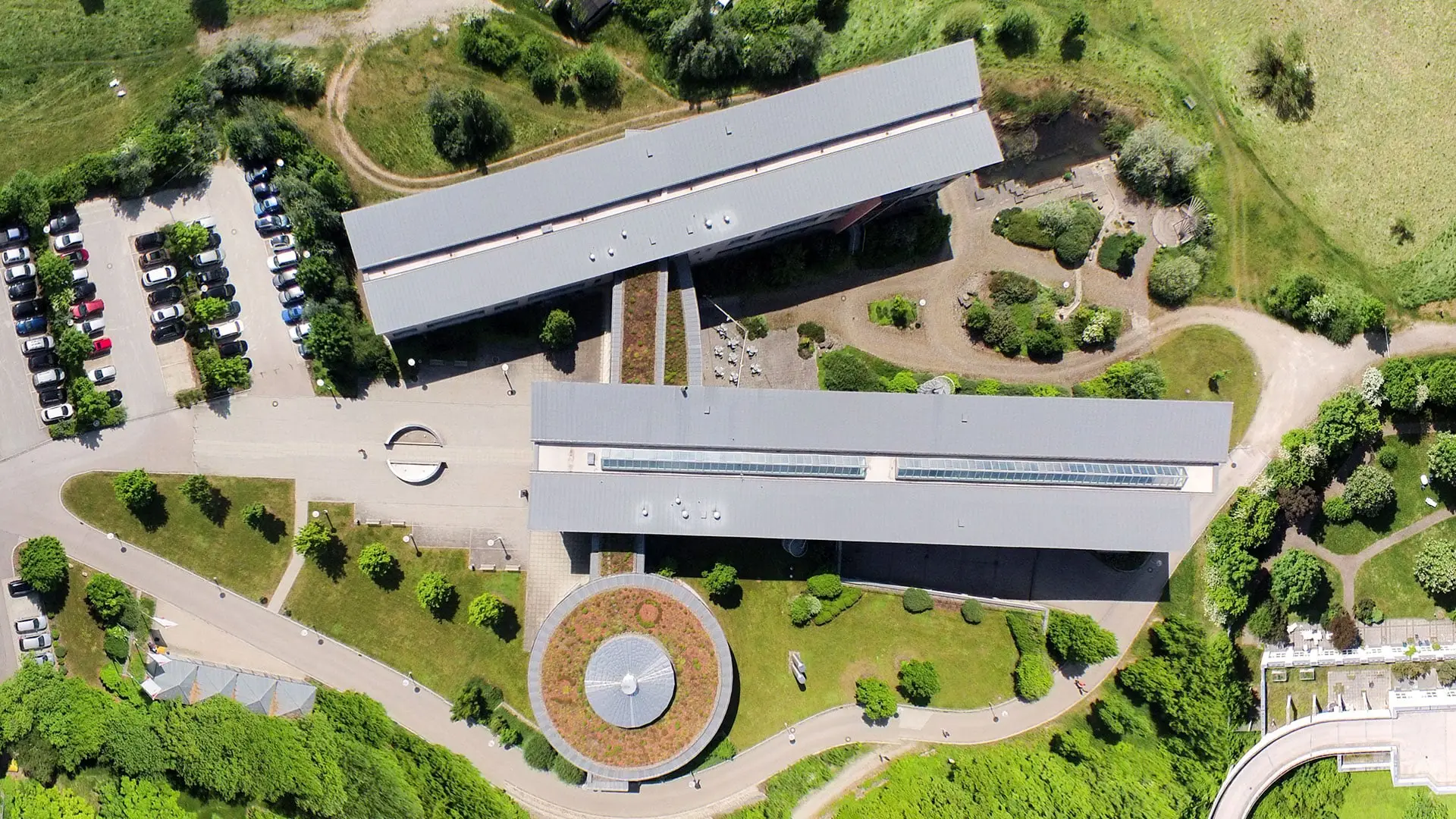 Aerial view of the Middle Franconia district hall with its round courtyard surrounded by greenery